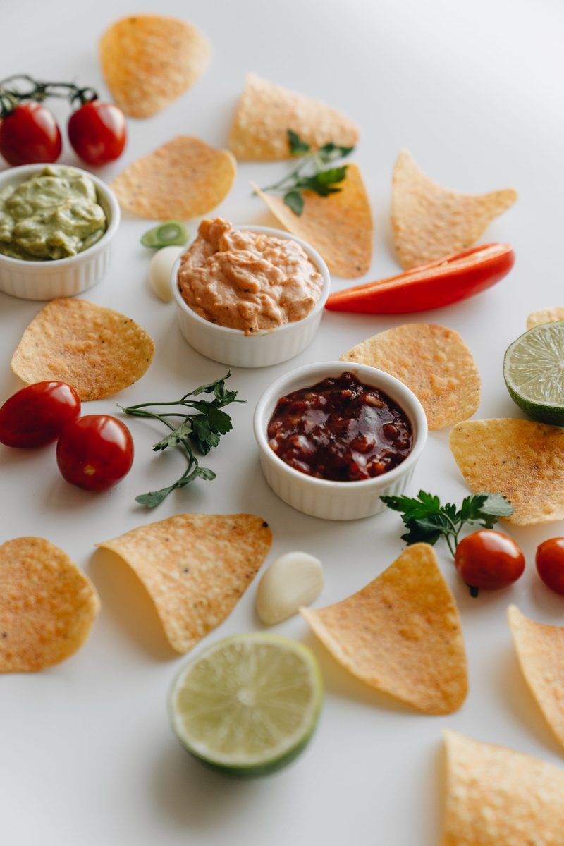 Finished chipotle lime tortilla chips served with lime and dips