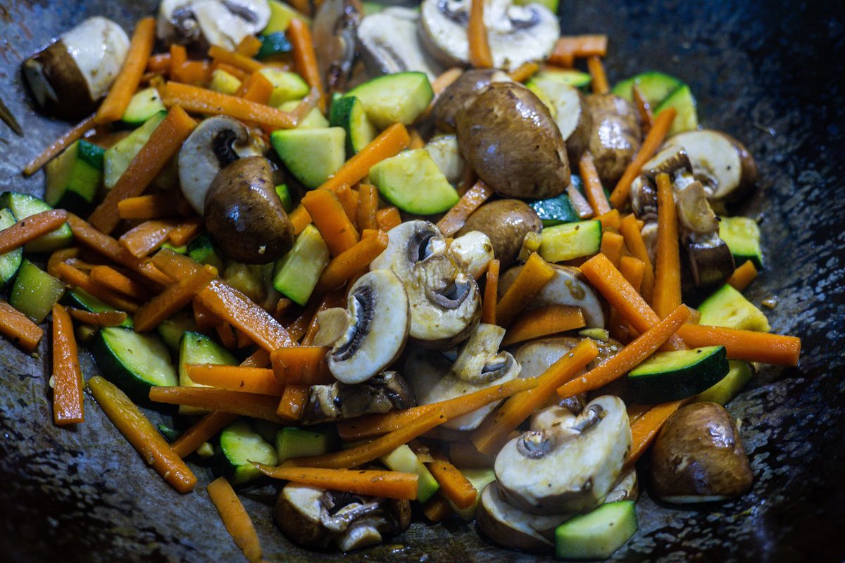 Finished Thai stir-fried pumpkin with egg, photographed as a colorful cooked vegetable stir-fry