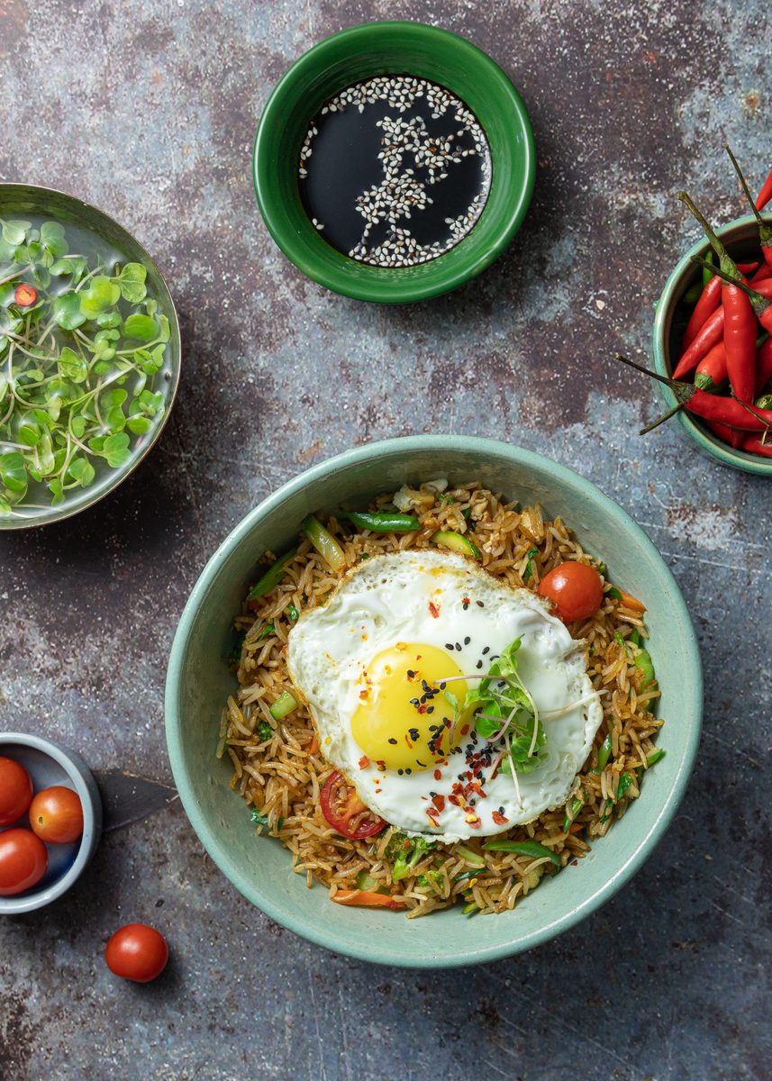 Khao Pad Thai fried rice with egg and vegetables in a bowl