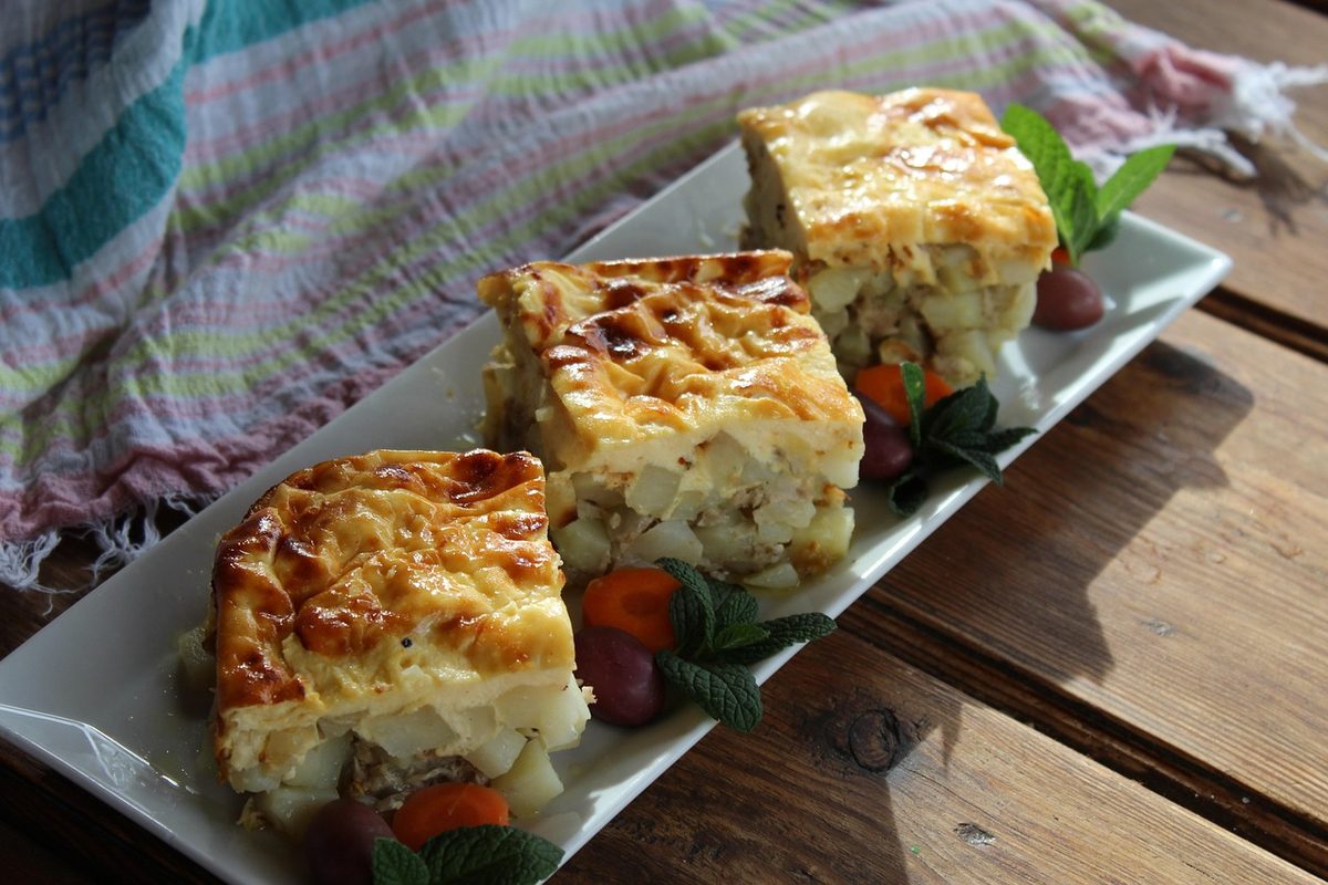 Finished Bulgarian moussaka with potatoes and meat served on a plate