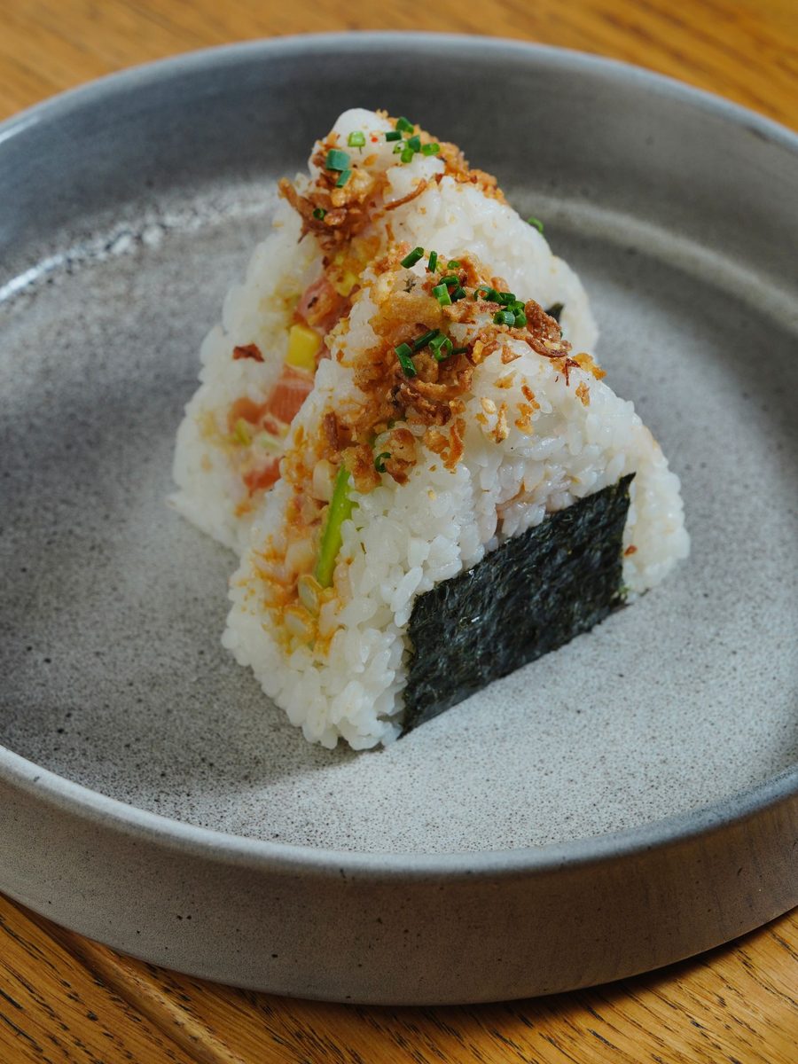 Finished Japanese onigiri rice balls with seaweed and toppings