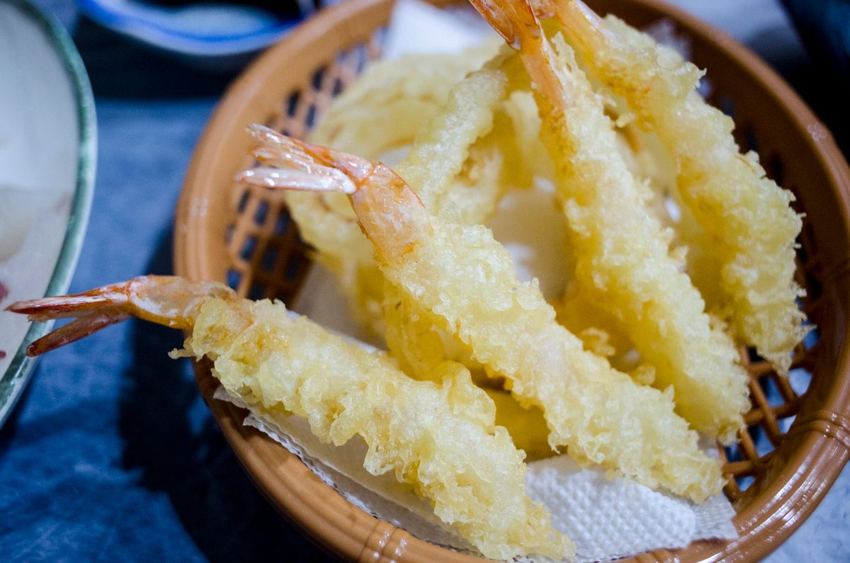 Crispy shrimp tempura served in a traditional basket