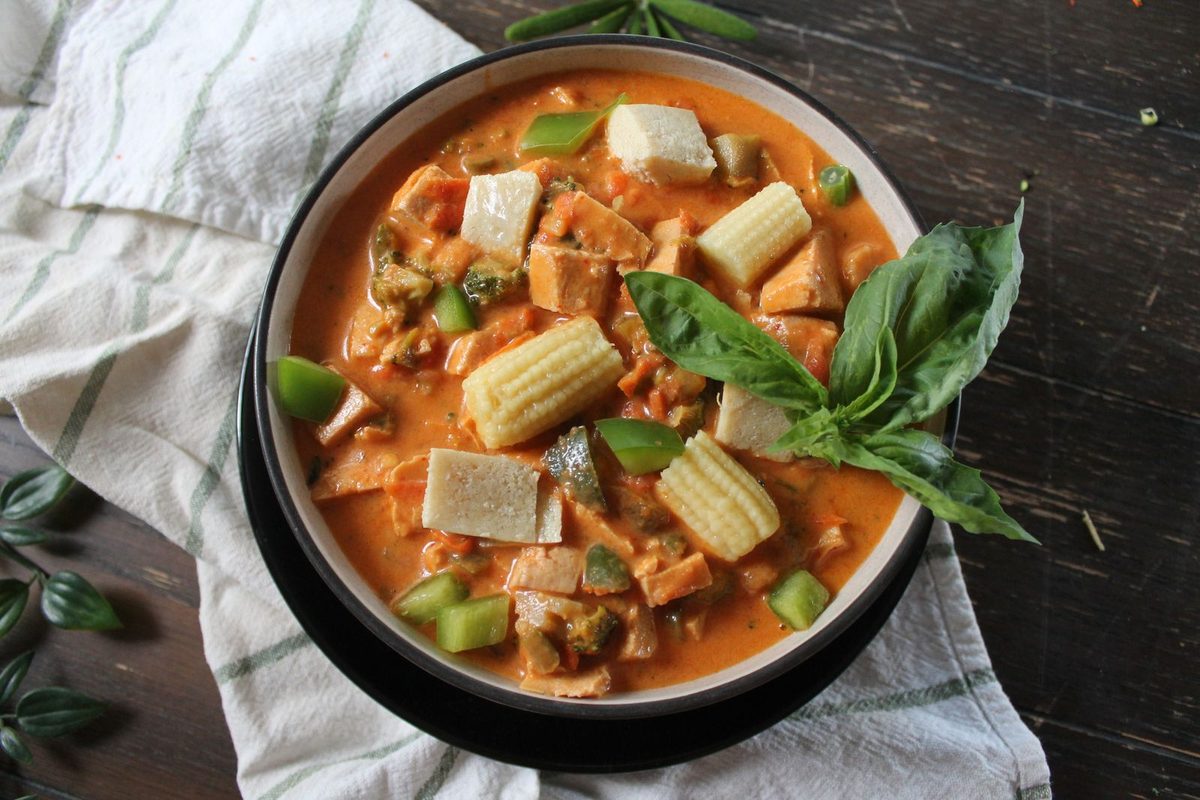 Finished Thai red curry with tofu and fresh vegetables, a visual stand-in for Thai red curry paste