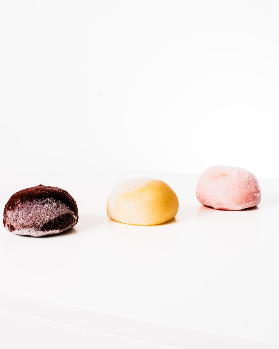 Finished Yubeshi (Japanese walnut mochi confection), colorful mochi pieces arranged on a white surface